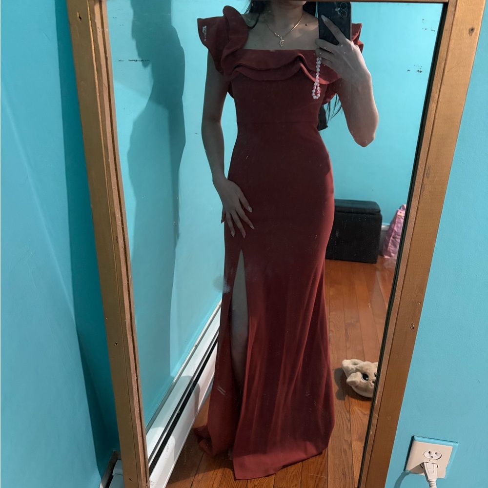 Charlotte Russe dress in rust color featuring ruffle sleeves and a side slit